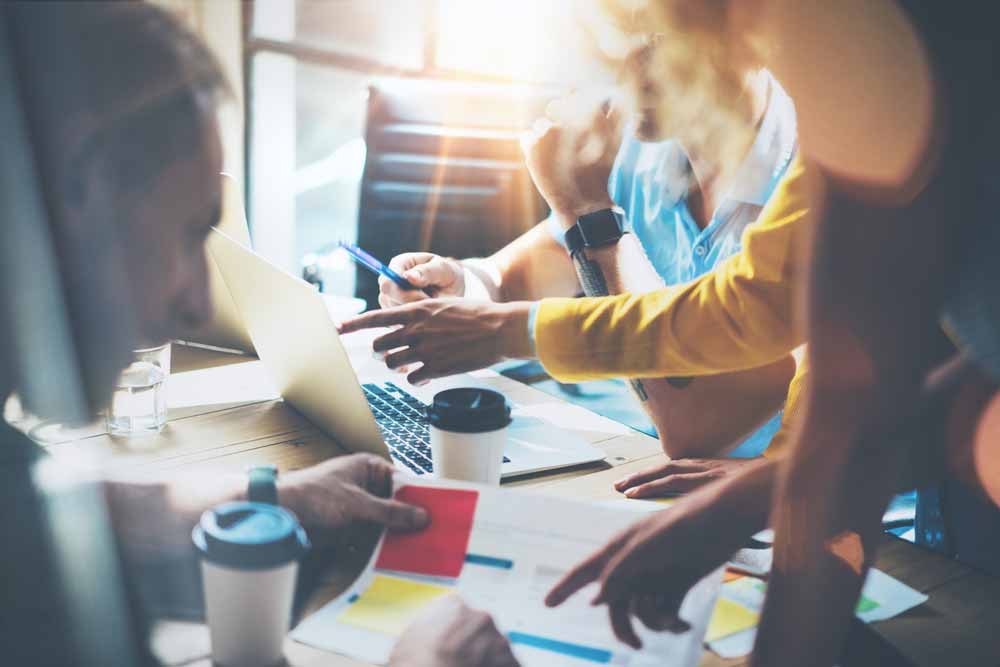Young Group Coworkers Making Great Business Decisions.Marketing Team Discussion Corporate Work Concept Studio.New Startup Creative Idea Presentation Laptop.People Working Wood Table Documents.Blurred., Orlen